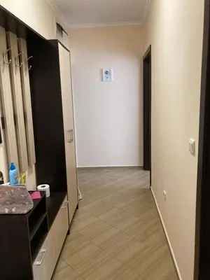 a corridor of a room with a hallway at Апартамент Даскала с паркомясто in Burgas City
