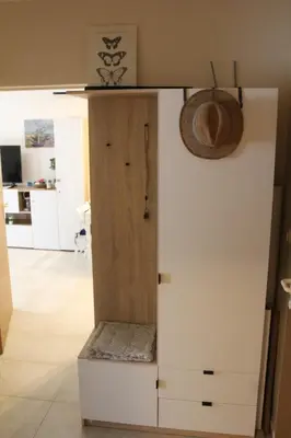 a white cabinet with a door in a room at Pomorie Residence 1-bedroom apartment with pool & free parking, 300 m to the beach in Pomorie