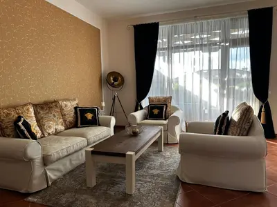 a living room with two couches and a coffee table at Sozopolis Cliffs Luxury Seaview Villa in Sozopol