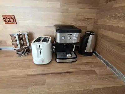 a coffeemaker sitting on a counter with a coffee maker at Cactus beach apart Obzor in Obzor