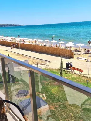 a view of the beach from the balcony of a resort at Cactus beach apart Obzor in Obzor
