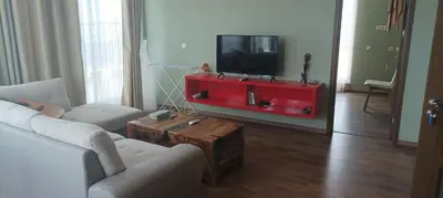 a living room with a tv and a couch and a table at Swan Bay complex in Chernomorets