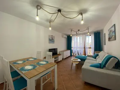 a living room with a couch and a table at KALIA A16 Private One Bedroom Apartment in Sunny Beach