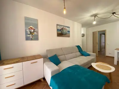 a living room with a couch and a table at KALIA A16 Private One Bedroom Apartment in Sunny Beach