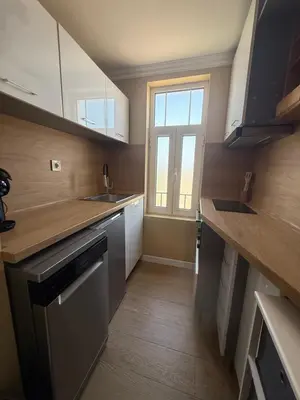 a small kitchen with a sink and a window at Chernomorets Apartment in Chernomorets