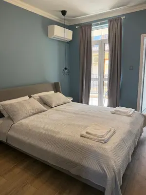 a bedroom with a bed with two towels on it at Chernomorets Apartment in Chernomorets