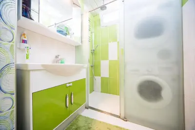 a bathroom with a sink and a shower at Tsarigradska in Burgas City