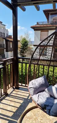 a bed on the balcony of a building at Eve Santa Marina Apartments - sea, pools, relax in Sozopol