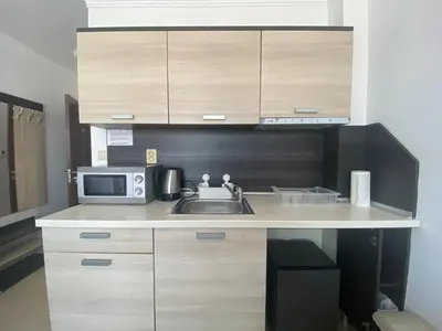 a small kitchen with a sink and a microwave at SUMMER BREEZE 503 Private Studio SUNNY BEACH in Sunny Beach