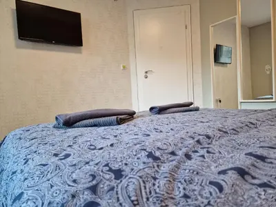 a bedroom with a bed with two pillows on it at Marsselis Luxe Port Apartment in Varna City