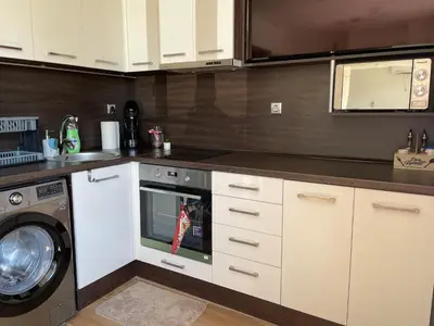 a kitchen with a washing machine and a washer at Studio Rêve in Burgas City
