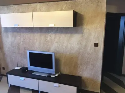 a computer monitor sitting on a desk in a room at Heaven Lux Apartments in Sunny Beach