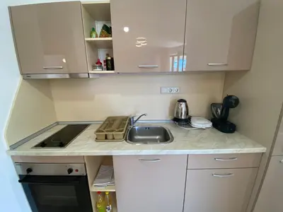 a small kitchen with a sink and a stove at ROYAL SUN O 31 Apartment Royal Sun in Sunny Beach
