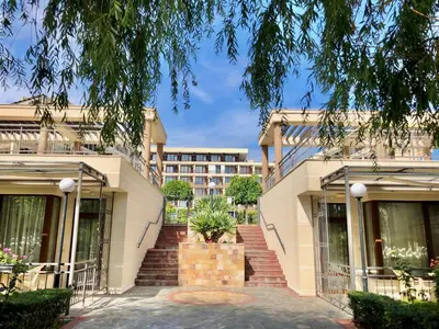 a building with a staircase in front of it at Sorrento - Menada Apartments in Sveti Vlas