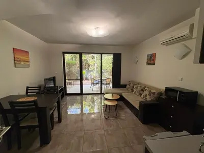 a living room with a couch and a table at The White Houses Complex in Nesebar