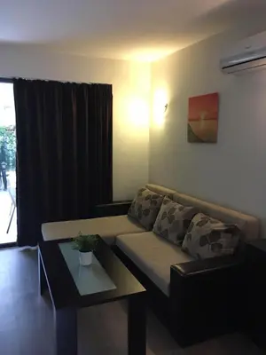 a living room with a couch and a coffee table at The White Houses Complex in Nesebar