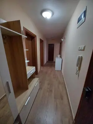 a hallway with a bathroom with a sink and a phone at Апартамент Морски оазис in Burgas City