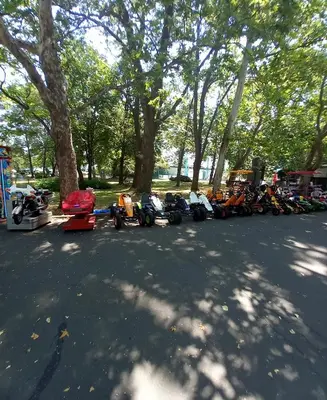 a row of motorcycles parked on the side of a street at Апартамент Морски оазис in Burgas City