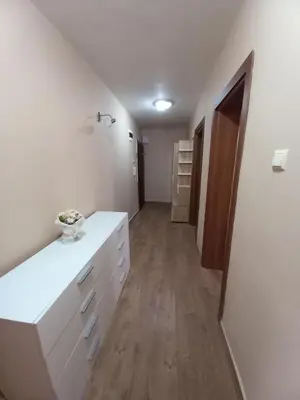 a room with a white counter and a hallway at Апартамент Морски оазис in Burgas City