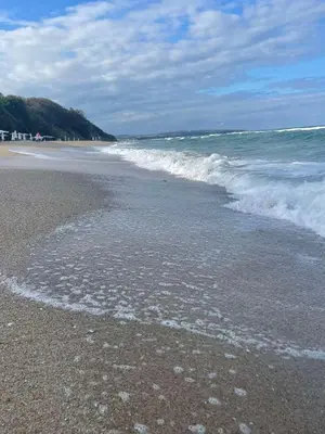 a beach with waves crashing on the shore at YooBulgaria-Obzor SP apartments in Obzor