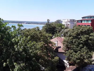 a view of a river and some buildings and trees at Kostovi Primorsko in Primorsko
