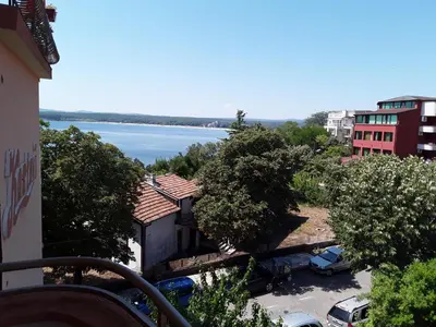 a view of the water from a balcony of a building at Kostovi Primorsko in Primorsko