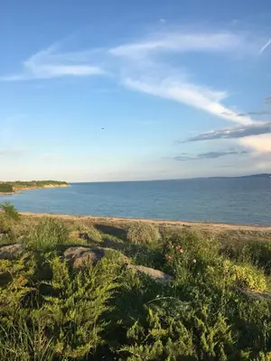 a view of the ocean from a sandy beach at LOVE apartment in Burgas City