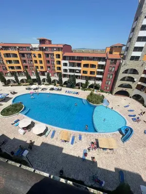 a large swimming pool in front of some buildings at Marina Cape SP private apartments in Aheloy