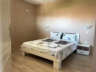 a bedroom with a bed in a room at Cozy 1BD Apartment with a Lovely Sea View by Flat Mаnаger in Sveti Vlas