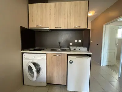 a kitchen with a washing machine and a sink at Cozy 1BD Apartment with a Lovely Sea View by Flat Mаnаger in Sveti Vlas