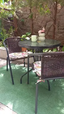 a table and two chairs and a table and chairs with a table and a table at Венета 1 in Sozopol