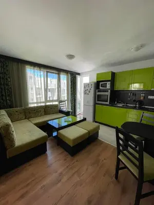 a living room with a couch and a table at Atlantik-Byala SP apartments in Byala