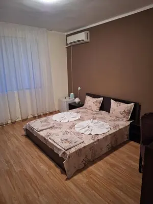 a large bed in a room with at Къща за гости Симеонови in Sozopol