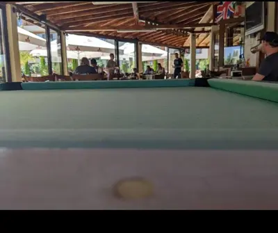 a cue ball on top of a pool table at 1-bedroom Apartment in a Resort with 6 Pools, Top Floor, Stunning Sunset View in Sunny Beach