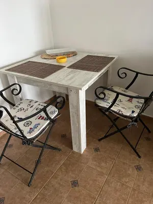 a table with two chairs and a table with a table and two at Complex Monastery 1 -Marina Dinevi -Saint Vlas in Sveti Vlas