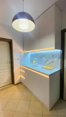 a large aquarium in a kitchen with a light at Свети Йоан in Sozopol