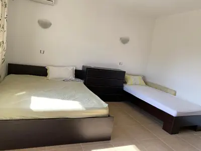 a bedroom with two twin beds in a room at The modern apartment in the ancient city in Sozopol