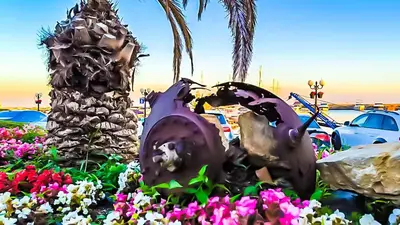 a statue of a palm tree and flowers at William's apartments - fourth pretty studio in Sveti Vlas