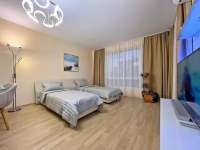 a bedroom with two beds and a flat screen tv at Premium Apartment Villa Aristo in Sveti Vlas