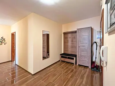 a living room with a wooden floor and white walls at Premium Apartment Villa Aristo in Sveti Vlas