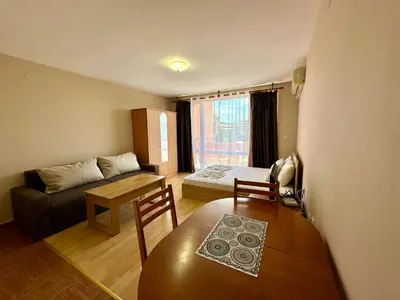 a living room with a couch and a table at Privilege Fort Beach - Menada Apartments in Elenite