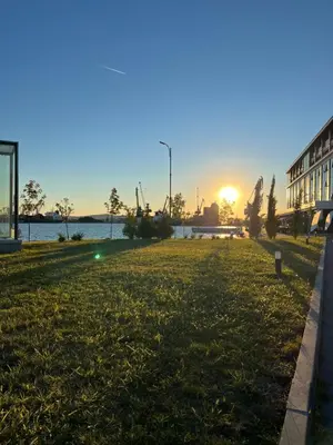 a park with the sunset in the background at Azzurro Premium Apartment on Bulevard Bogoridi in Burgas City