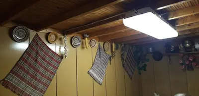 a room with flags and clocks on the wall at Krimski Guest House and Bungalows in Byala