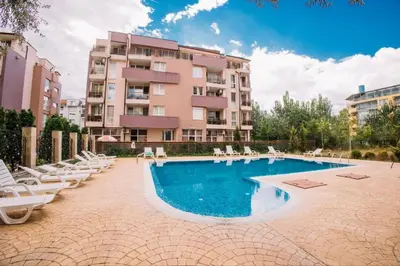 a swimming pool in front of a building at LifeStyle 6 in Sunny Beach
