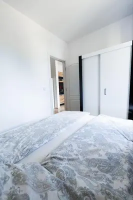 a white bedroom with a large bed in it at LifeStyle 6 in Sunny Beach