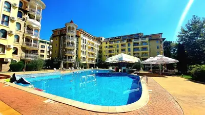 a large swimming pool in front of a hotel at Summer Dreams - Menada Apartments in Sunny Beach