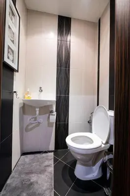 a bathroom with a toilet and a sink at При Галя / Прекрасен апартамент в тих квартал in Varna City