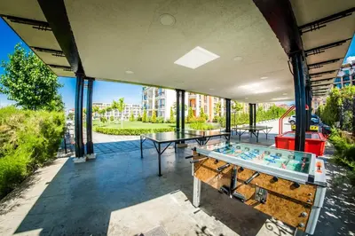 a patio with a table and ping pong ball at Premier Fort Beach Hotel in Sveti Vlas