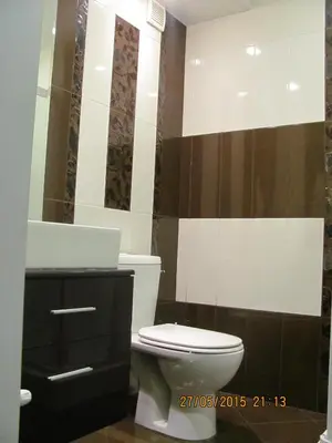 a bathroom with a toilet and a sink and a mirror at Dimitur Jekov Guest House in Obzor