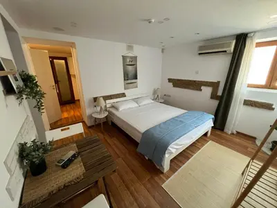 a bedroom with a large bed in a room at Vi Del Mar Apartments Varna in Varna City